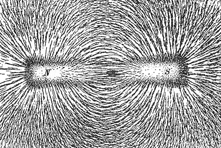 Картина силовых линий магнитного поля, создаваемого постоянным магнитом в форме стержня. Так распределились железные опилки на листе бумаги